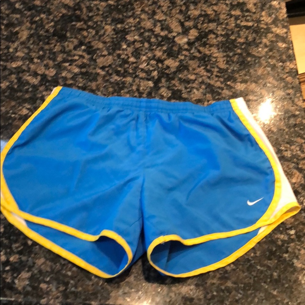 Blue and yellow Nike shorts